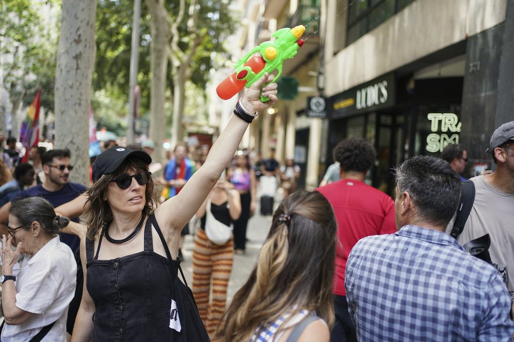 Spanish locals shoot water at visitors in protests against mass tourism